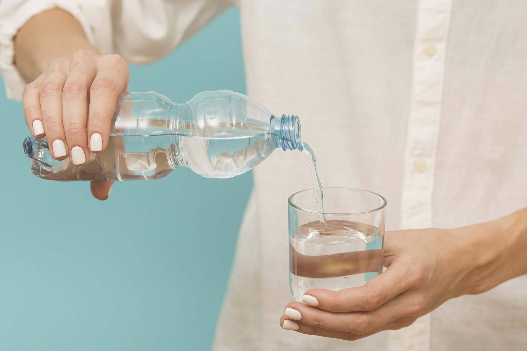 woman-pouring-water-into-glass.jpg woman-pouring-water-into-glass.jpg