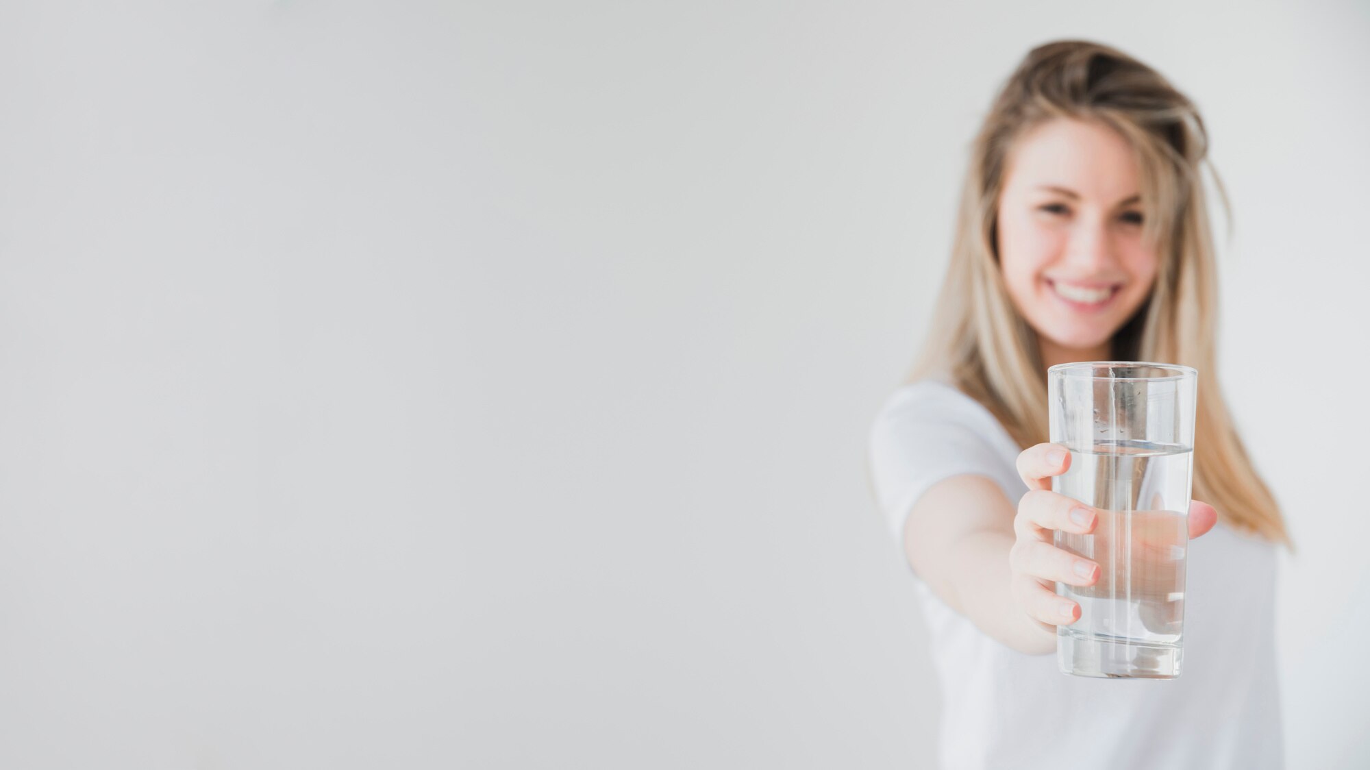 healthy-girl-holding-glass-of-water_23-2148113489.jpg