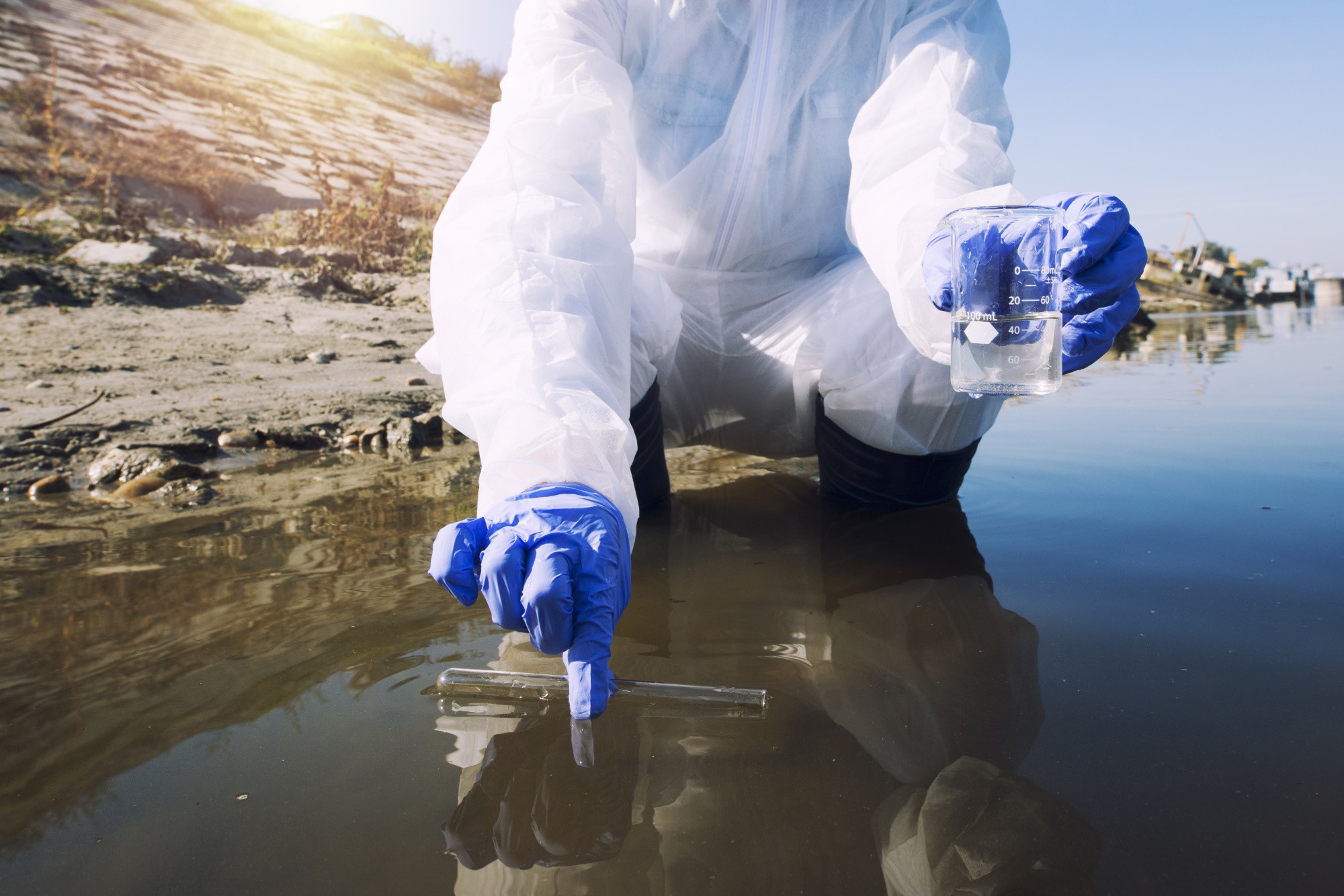 ecologist-taking-samples-water-with-test-tube-from-city-river-determine-level-contamination-pollution.jpg
