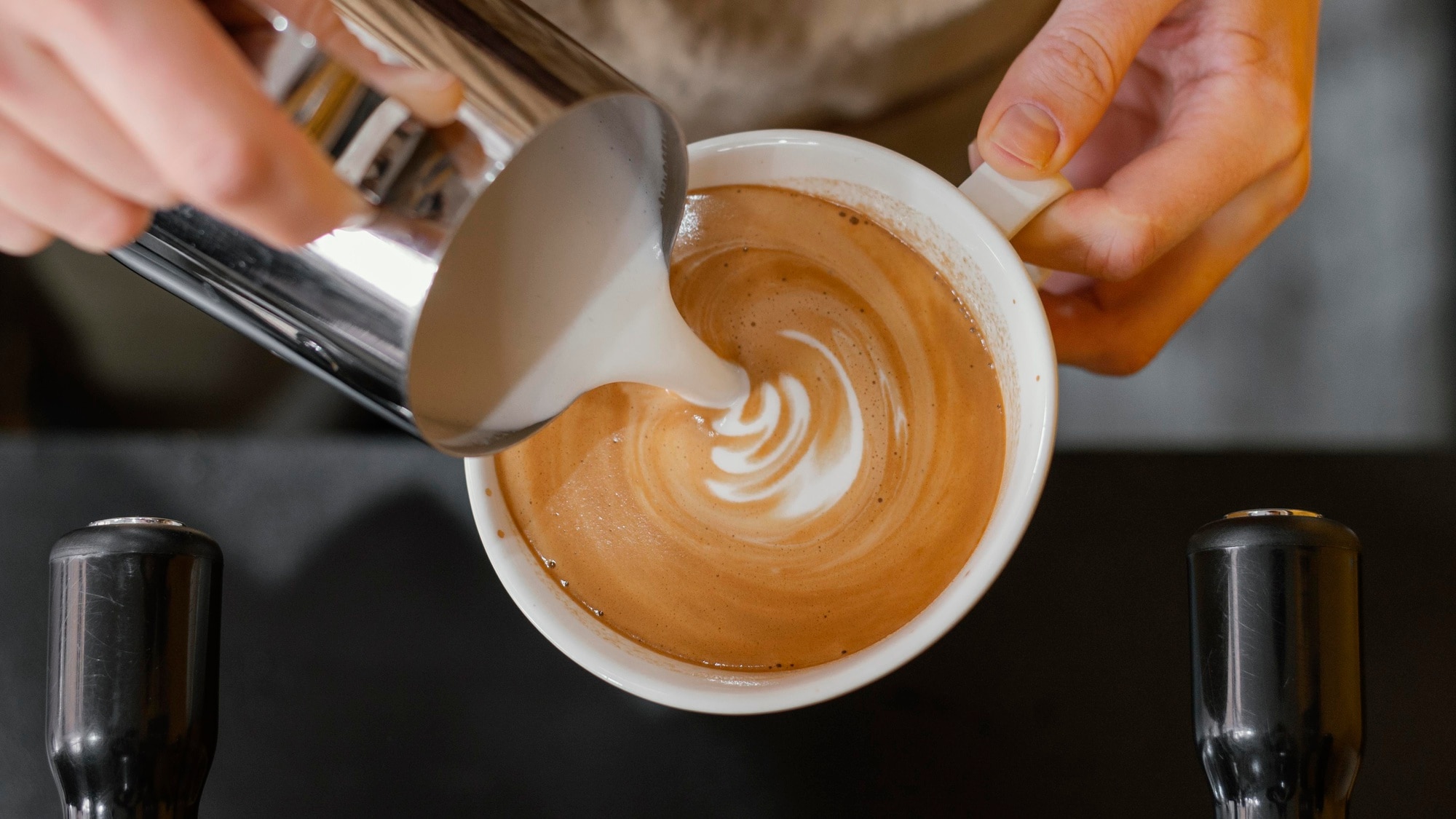 top-view-male-barista-pouring-milk-coffee-cups_23-2148824443.jpg