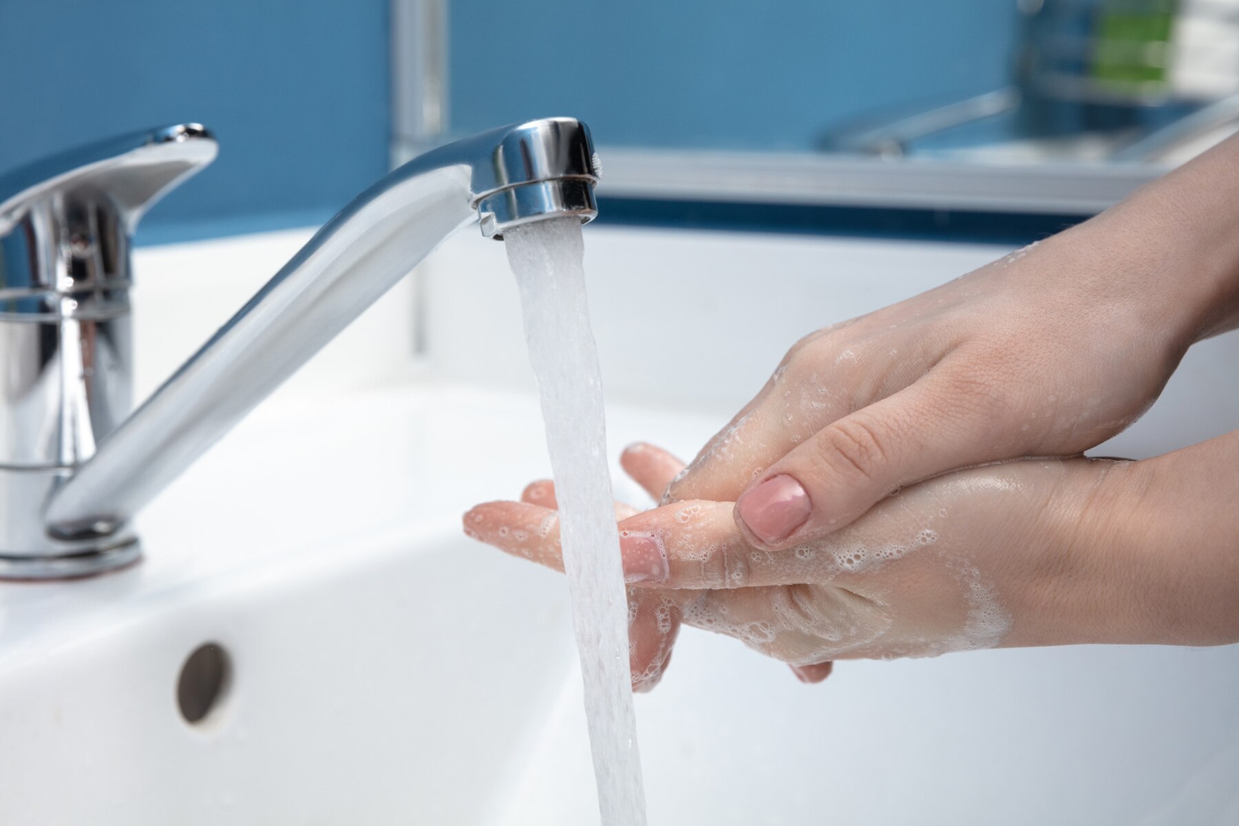 woman-washing-hands-carefully-in-bathroom-close-up-prevention-of-infection-and-flu-virus-spreading_155003-5515.jpg