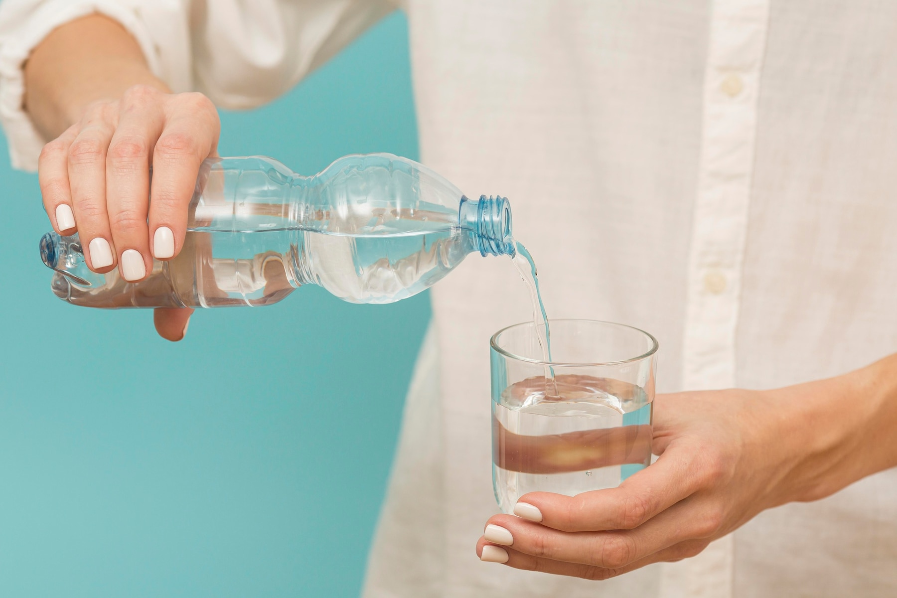 woman-pouring-water-into-glass_23-2148728795.jpg