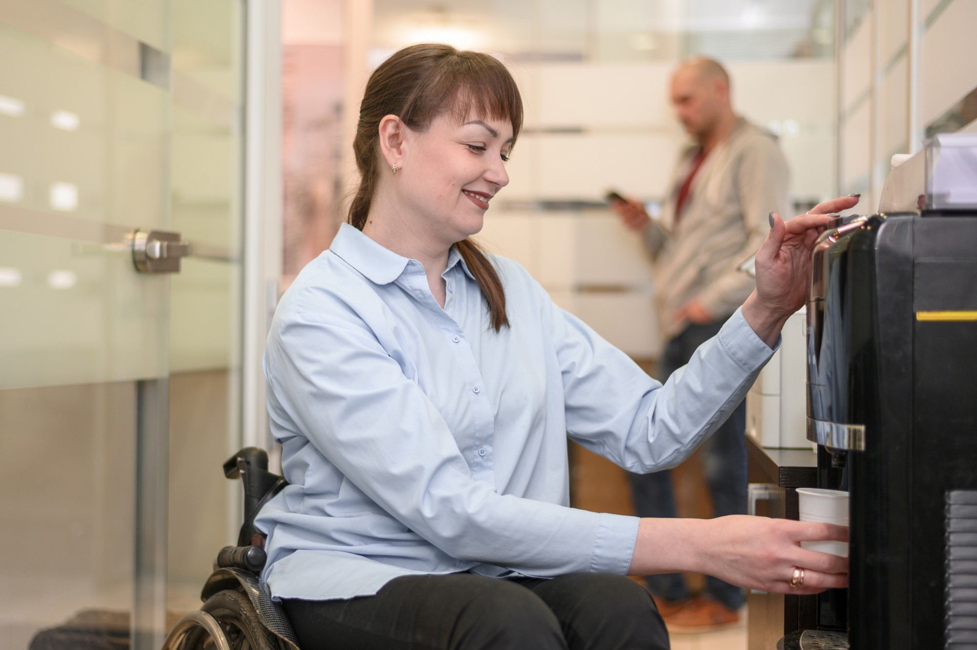 confident-businesswoman-wheelchair-pouring-water.jpg confident-businesswoman-wheelchair-pouring-water.jpg