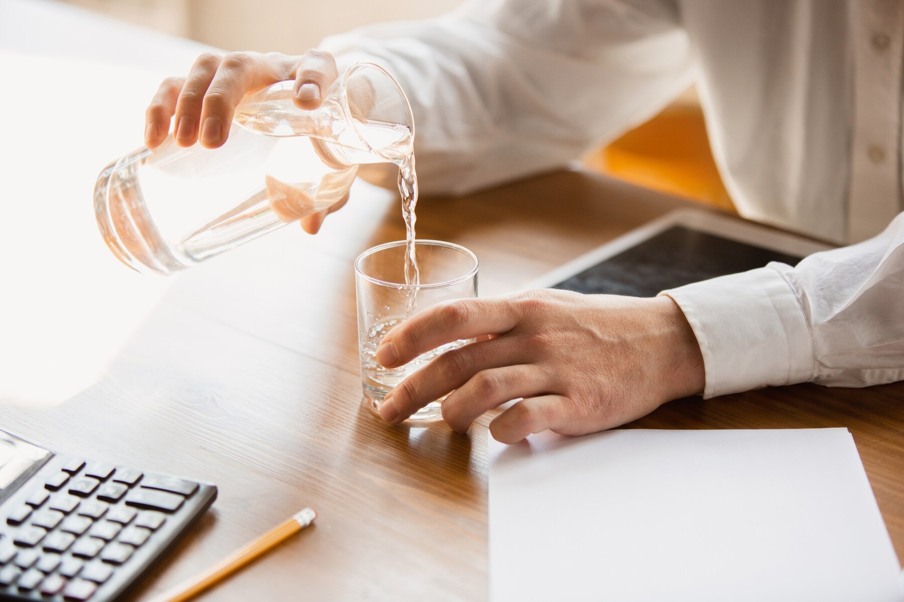 close-up-of-caucasian-male-hands-pouring-water-into-a-glass-concept-of-business-finance-job-online-shopping-or-sales_155003-36753.jpg