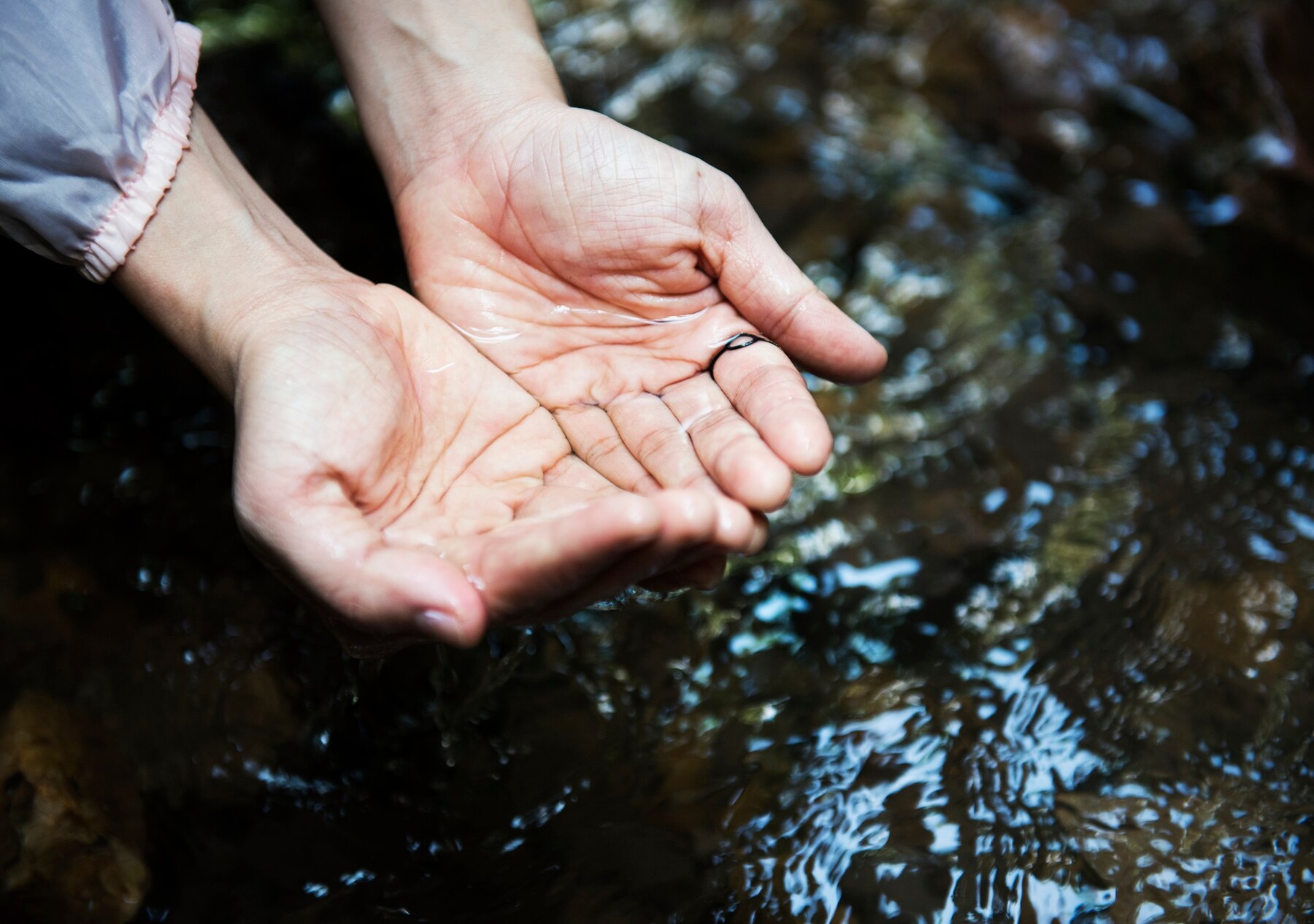 woman-getting-some-water-from-river-drink_53876-14403 (1).jpg