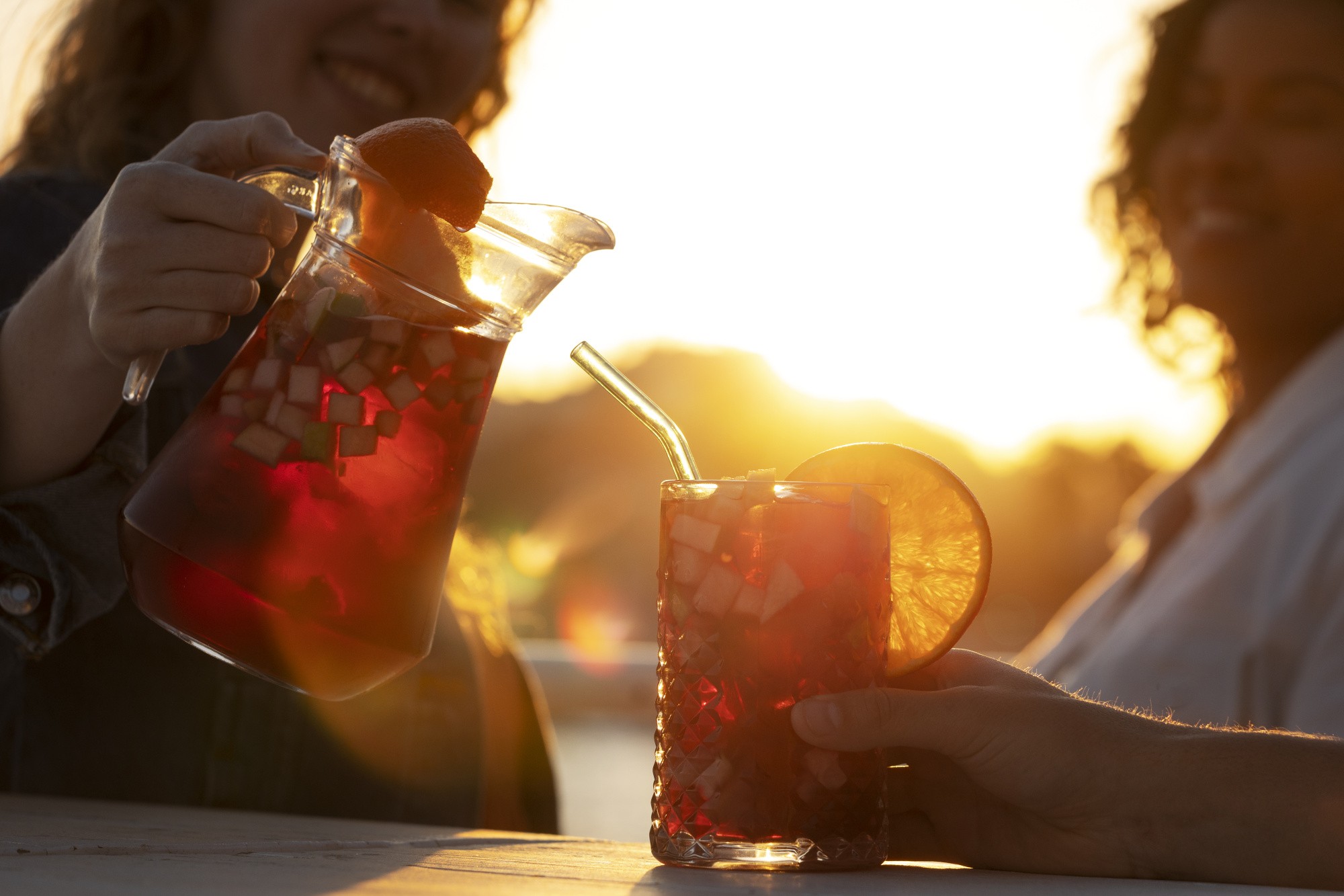 side-view-smiley-woman-pouring-sangria.jpg