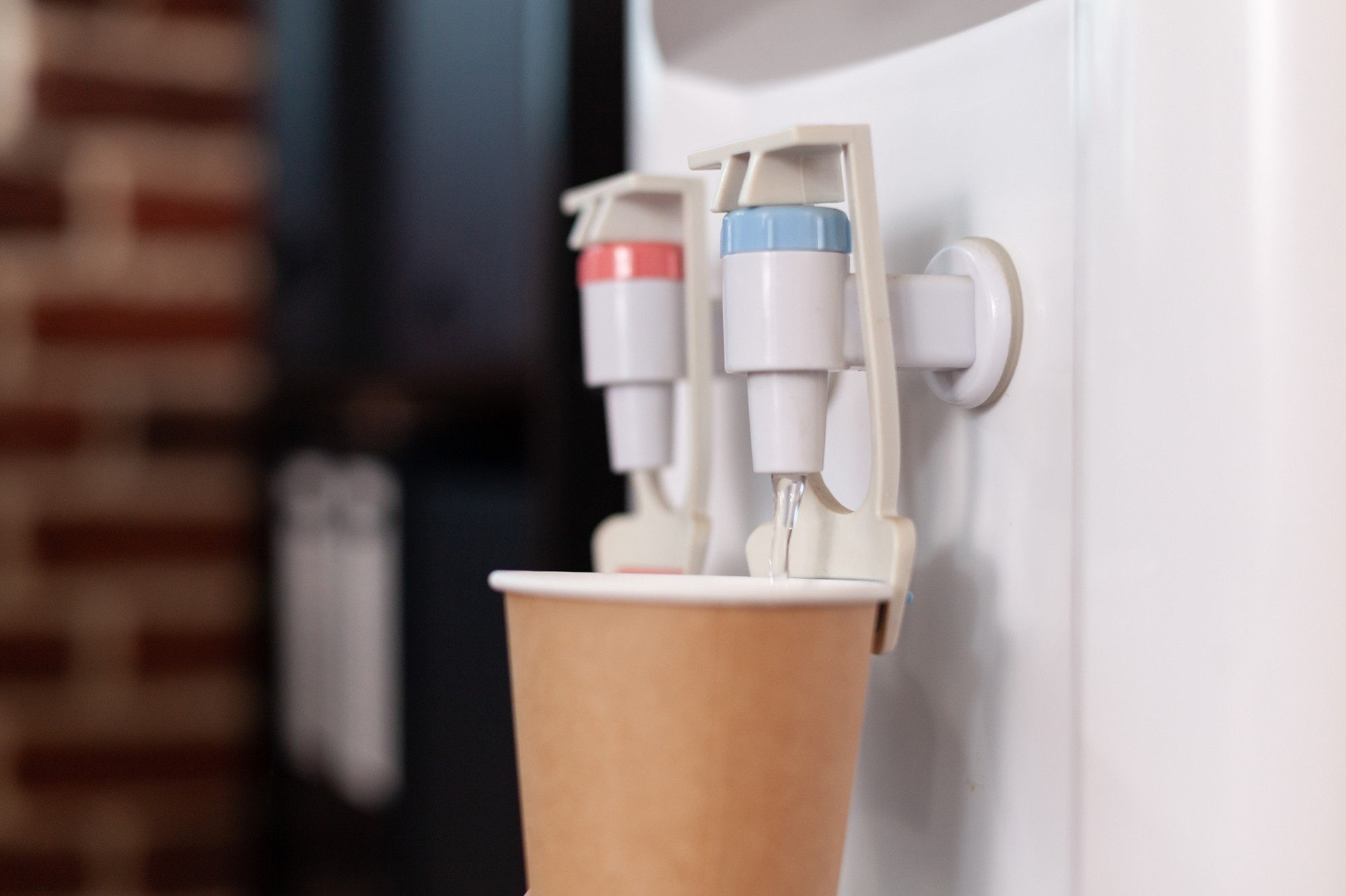 close-up-disposable-cup-water-cooler-startup-office-water-dispenser-with-hot-cold-faucet-used-refreshment-beverage-space-purified-mineral-water-gallon.jpg