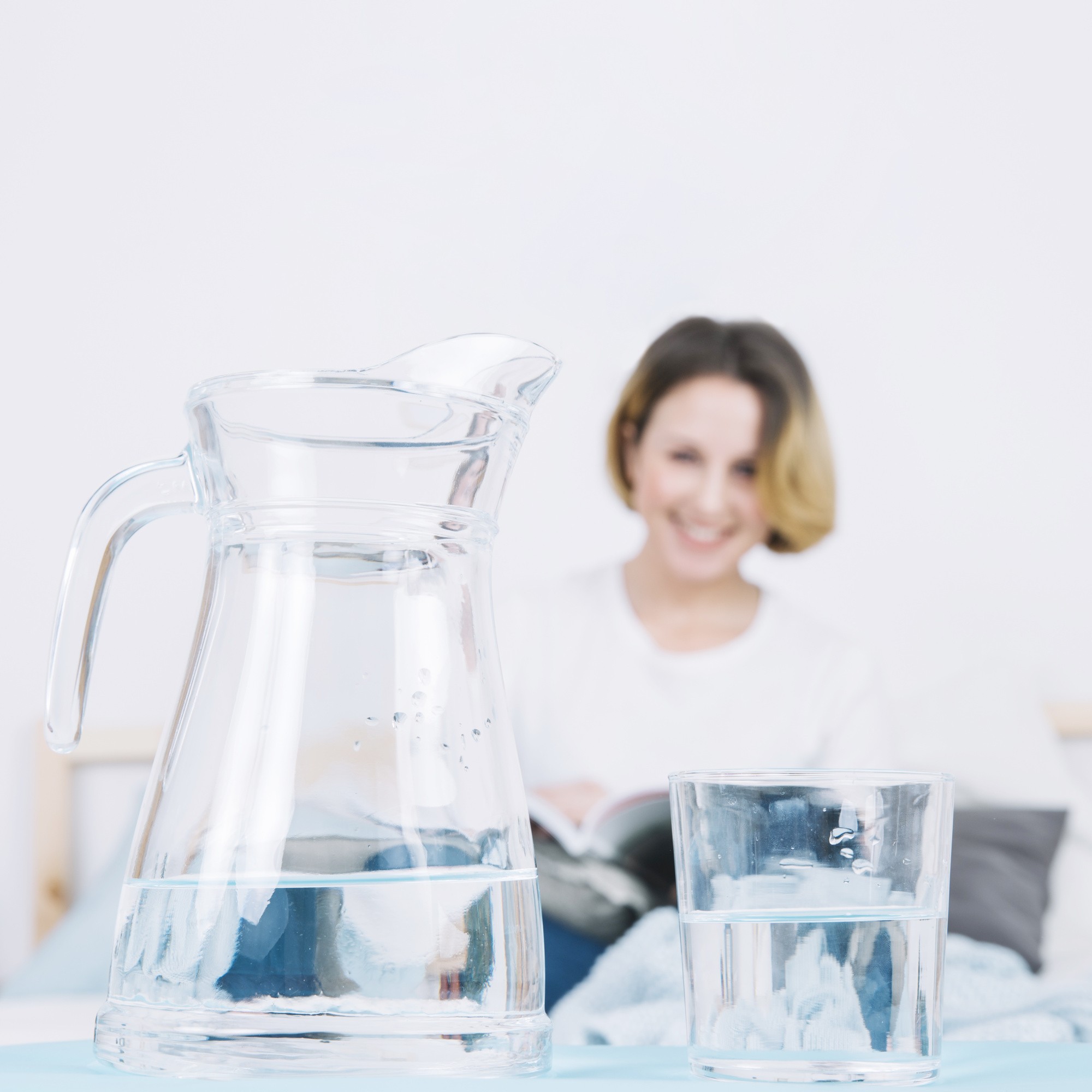 jug-glass-near-reading-woman.jpg