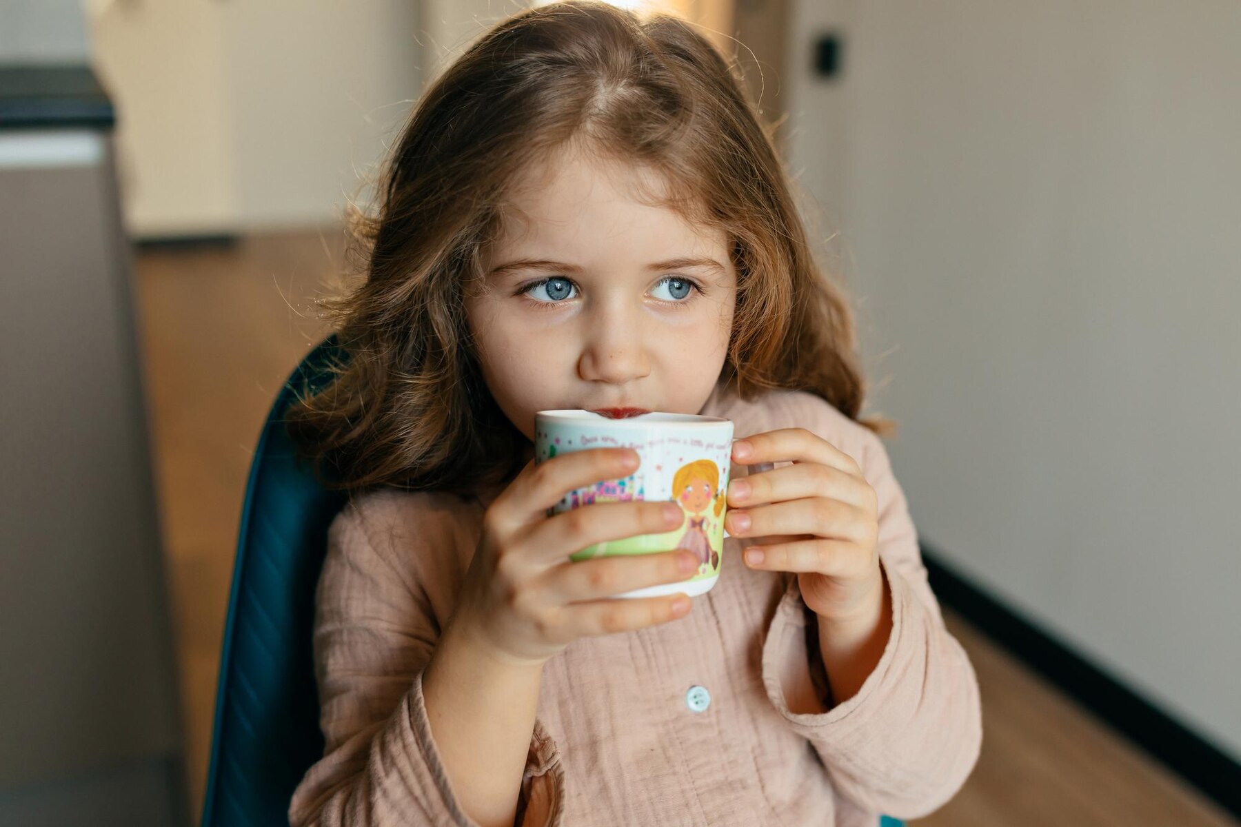 close-up-portrait-of-charming-lovely-little-girl-is-drinking-tea-at-home-in-the-morning-lovely-girl-at-the-kitchen-is-having-great-time_291650-1861.jpg