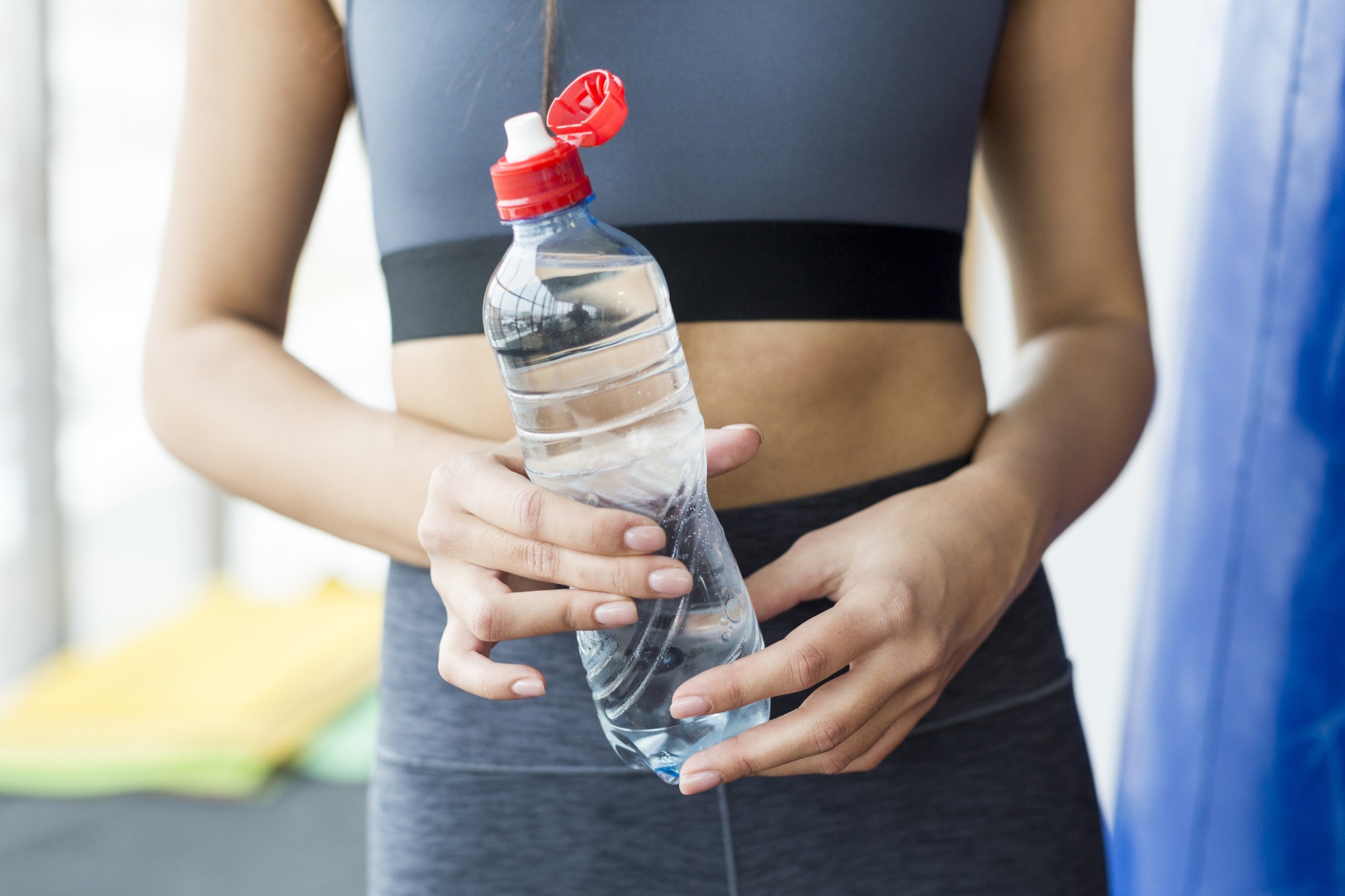 crop-woman-gym-with-water.jpg