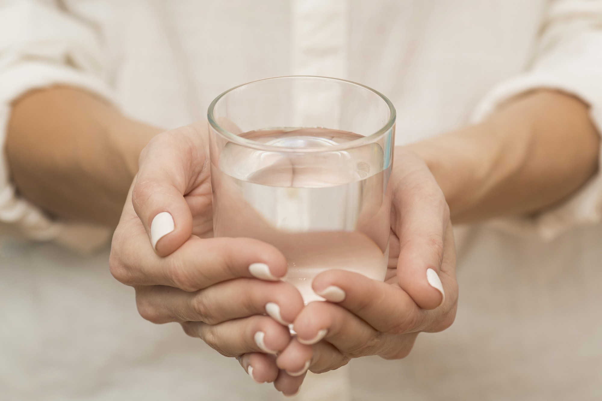 woman-holding-glass-filled-with-water.jpg