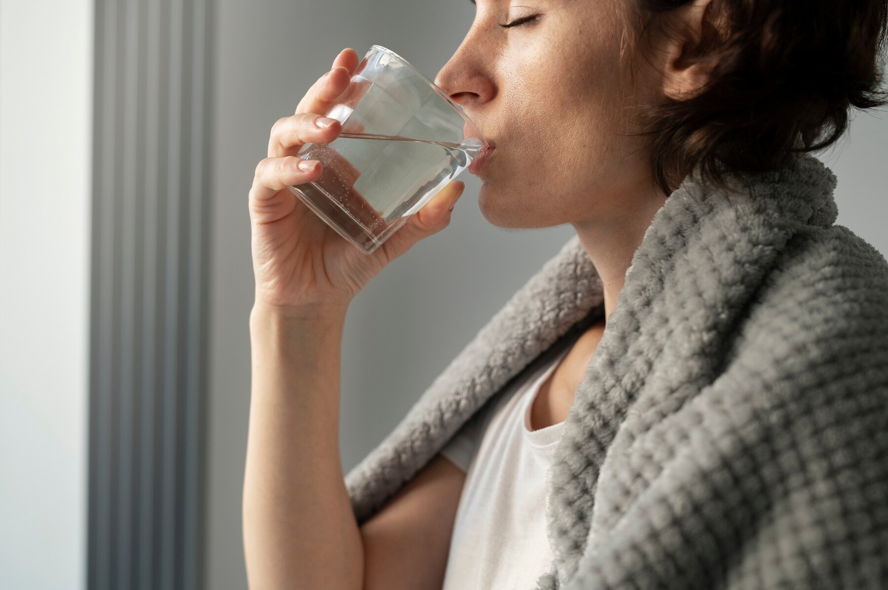 close-up-woman-drinking-water_23-2149149809.jpg