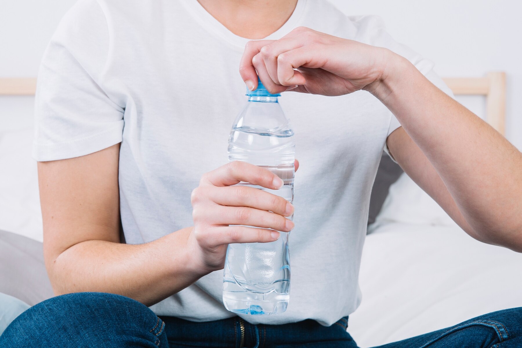 crop-woman-opening-water-bottle_23-2147765084.jpg